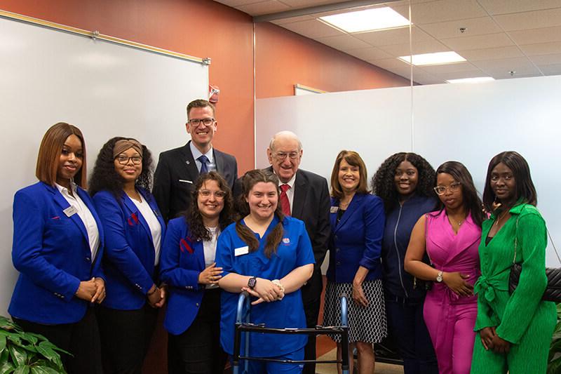 Dean of 在线博彩's Tanner Health System School of Nursing Dr. Jenny Schuessler, Herb Hatton, and 在线博彩 President Dr. Brendan Kelly recently gathered with nursing students.