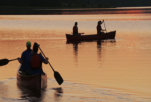 Students paddling at sunset at John Tanner